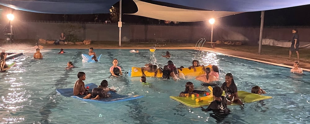 Fitzroy Crossing locals enjoying the pool at night