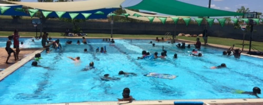 Aboriginal children enjoying a swim in the pool at Fitzroy Crossing