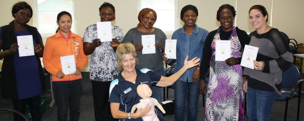 a group of women with a Royal Life Saving trainer displaying their heart Beat Club certificates