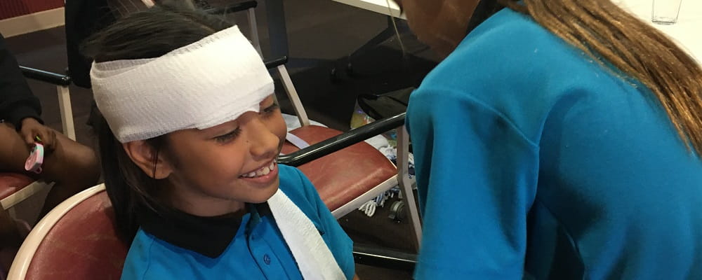 Baler Primary students practise first aid bandaging