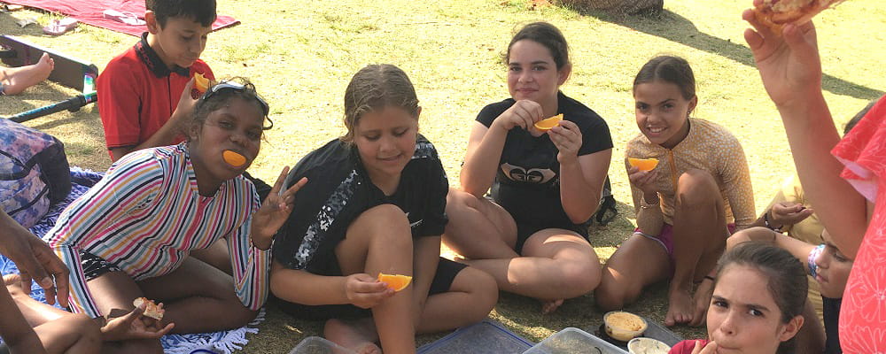 Hedland children enjoying fruit after a Swim for Fruit session