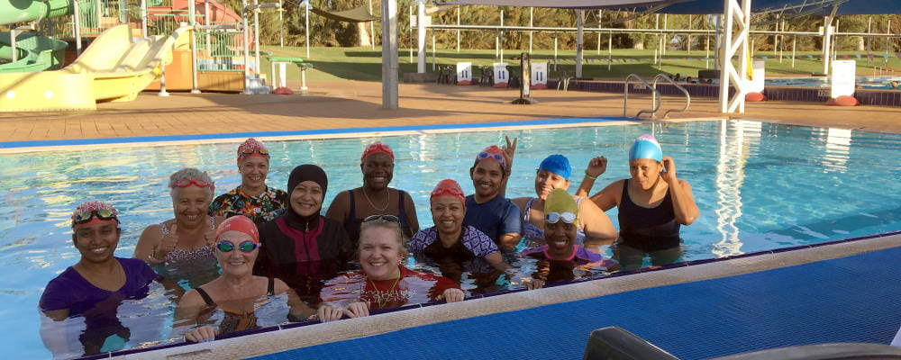Multicultural women in the pool with their swim instructor at Port Hedland