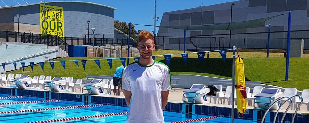 Jake Smith standing by the pool at HBF Stadium