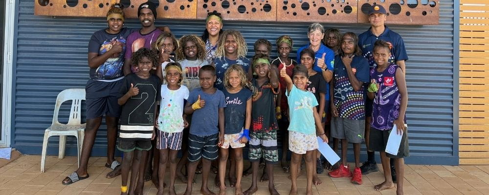 Jigalong children with Pool Manager Deb Gill during their Amazing Race