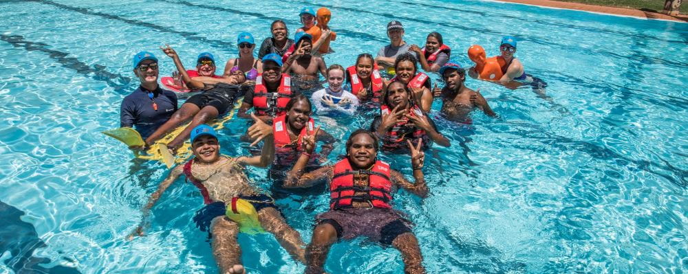 Jigalong youth and trainers in the pool during their Bronze Medallion training