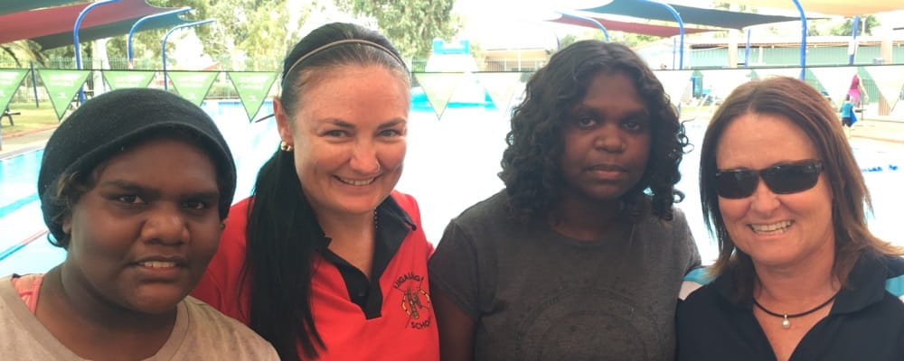Aboriginal women Jennifer and Chelsea with Jigalong pool manager Tracye Sykes and Community Trainer Diane McDermott