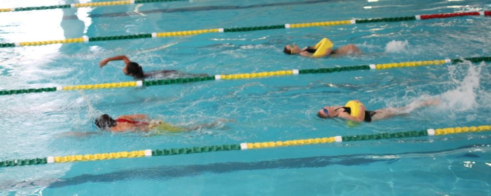 image of participants swimming in a rescue tube relay