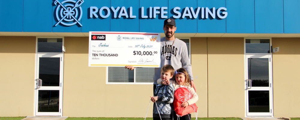 VIP winner Joshua with two of his children at the Royal Life Saving building with his giant cheque