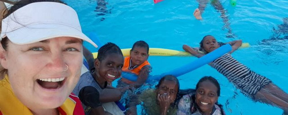 Pool Manager Sam Dalton with local children in the Kalumburu pool