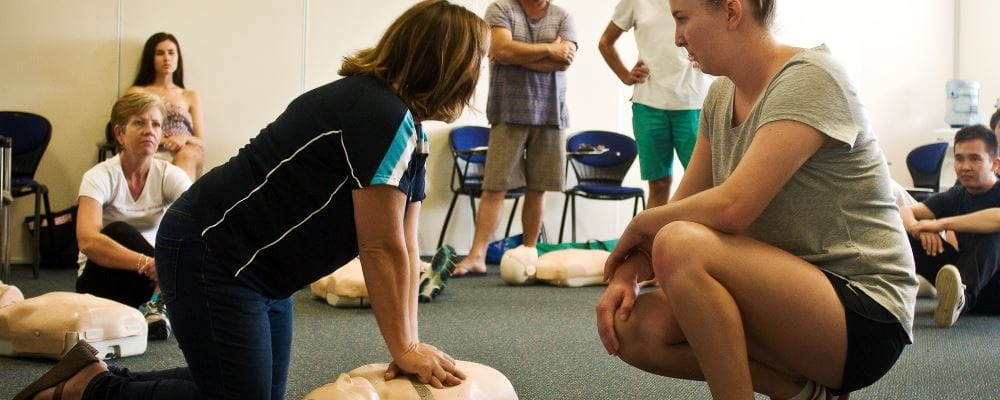 image of trainer teaching a class CPR