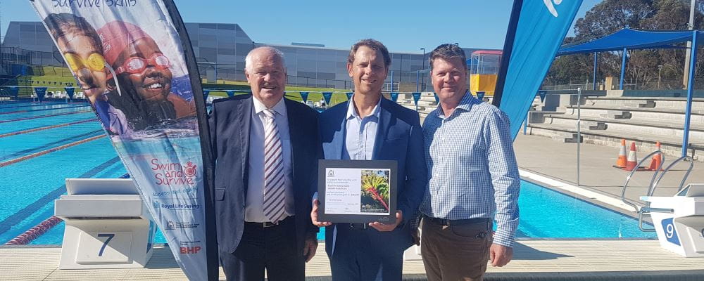 Sports Minister Mick Murray with RLSSWA CEO Peter Leaversuch and Lotterywest grant Development Officer Wayde McLean by the pool at HBF Stadium