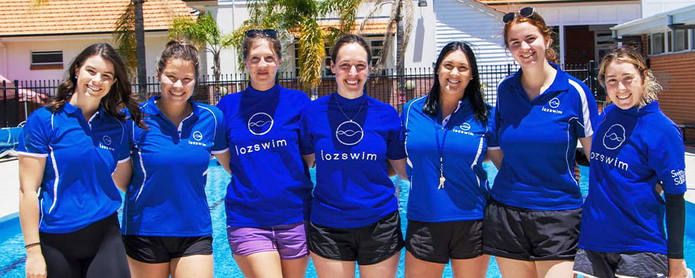Swimming instructors wearing blue Lozswim rashies