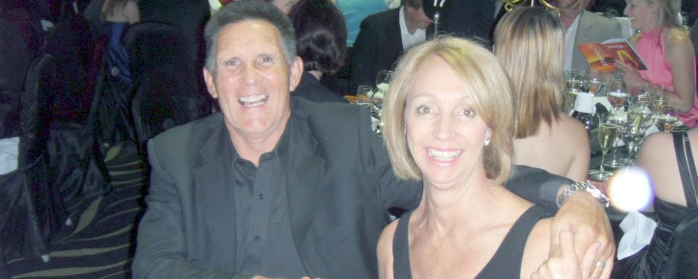 Alex and Lyn McKenzie sitting together at a table at an awards events