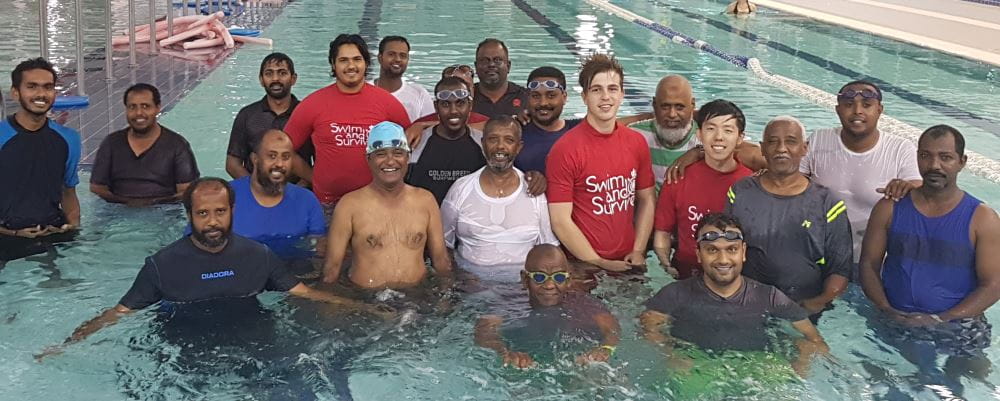 Multicultural men in the water with 3 Swim and Survive instructors at Cannington Leisureplex