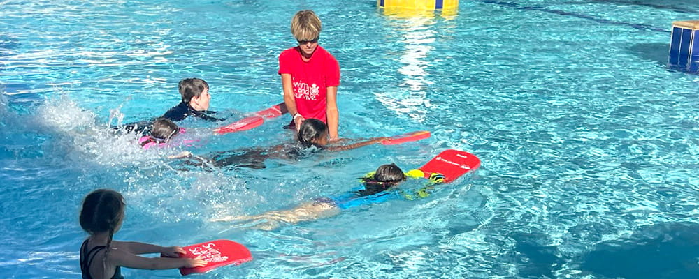 Nicole Durrant in the pool with children at Leonora