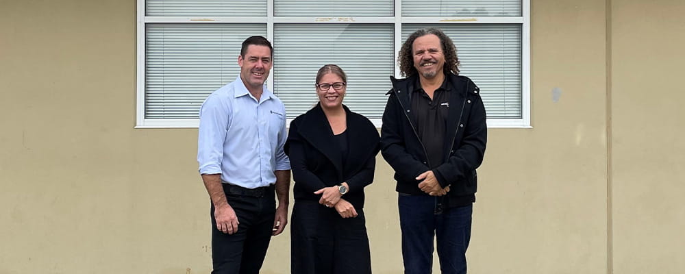 Royal Life Saving WA's Travis Doye, Reconciliation Action Plan Committee member Donna Oxenham and Dennis Simmons from Maar Koodjal 
