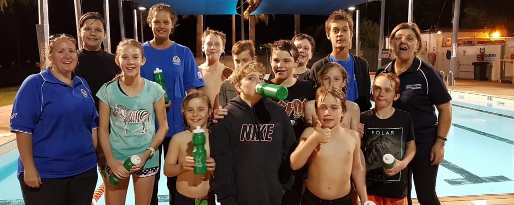 Several kids celebrate the launch of the Junior Lifeguard Club at Pannawonica Pool