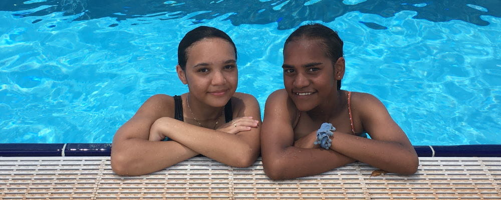 Jinali Bin Saad and Letisha Parker at the pool edge