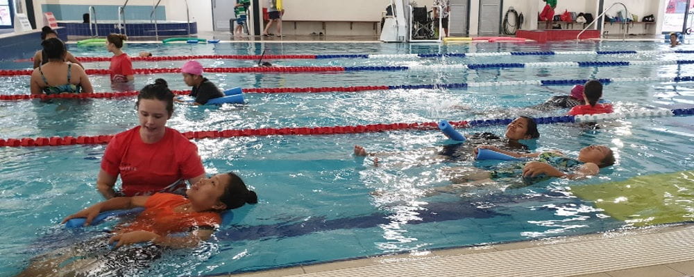 A swim instructor with multicultural women in the pool at Swan Active Ballajura