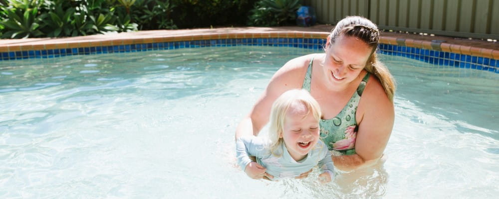 A mum with her toddler in the swimming pool