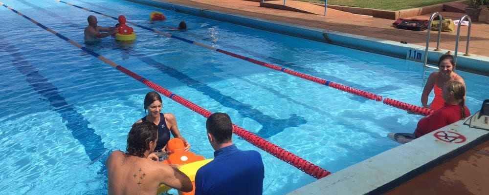 remote aboriginal swimming pool managers practising pool lifesaving skills