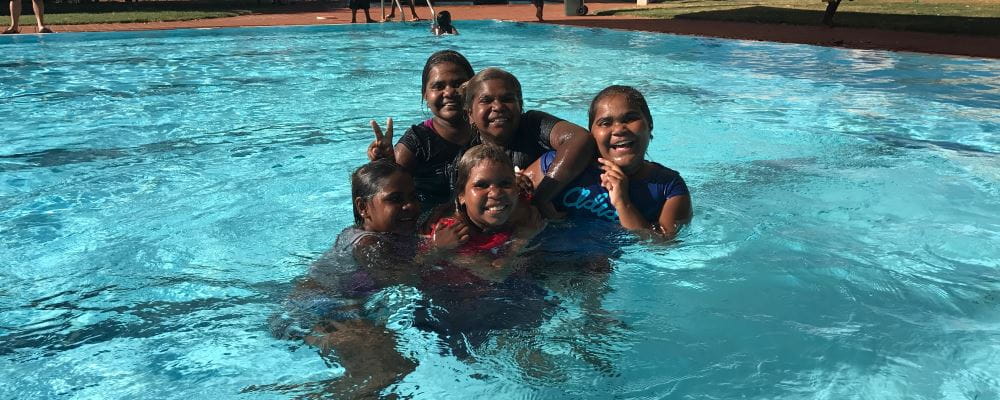 Aboriginal children having fun in the swimming pool at Jigalong Remote Community