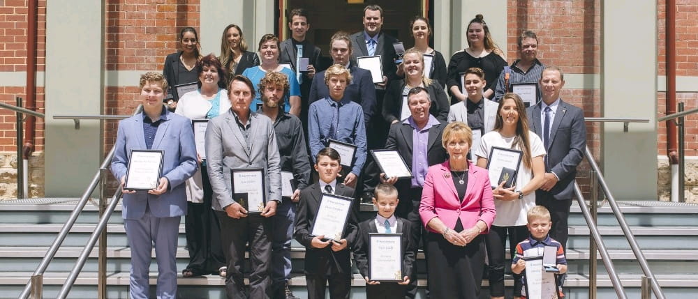 Winners of the Royal Life Saving Bravery Awards on the steps of Government House