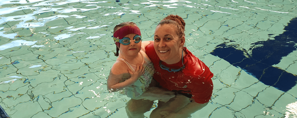 Kailee with her swim instructor in the pool at Kwinana Recquatic