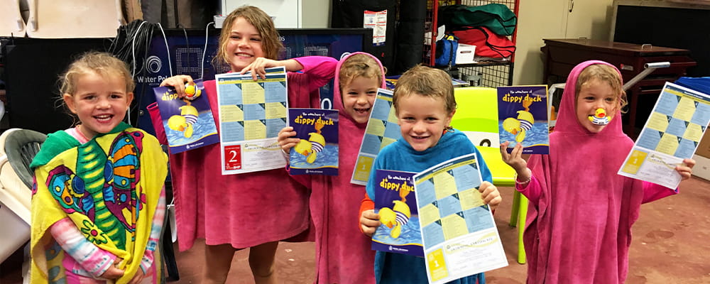 Children from Port Hedland School of the Air with their swimming certificates