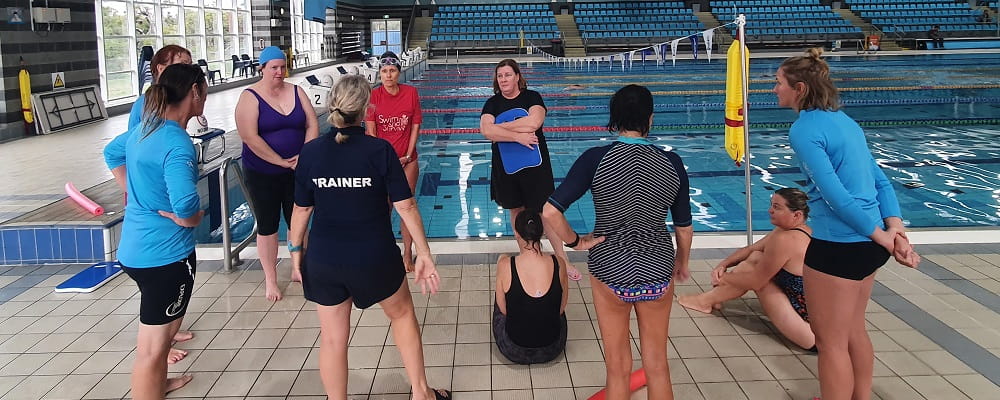 group of aquatic trainers at a pool workshop