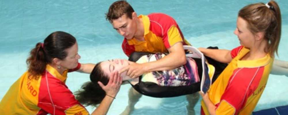 image of lifeguards performing an in pool rescue