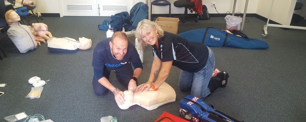 Course participant with community trainer Tracey Harris practising CPR on a manikin