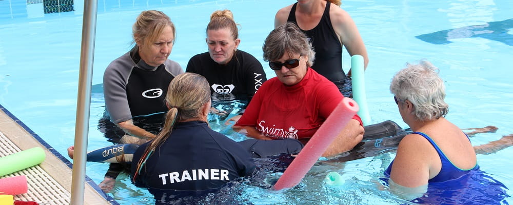 group of adults learning spinal rescue techniques