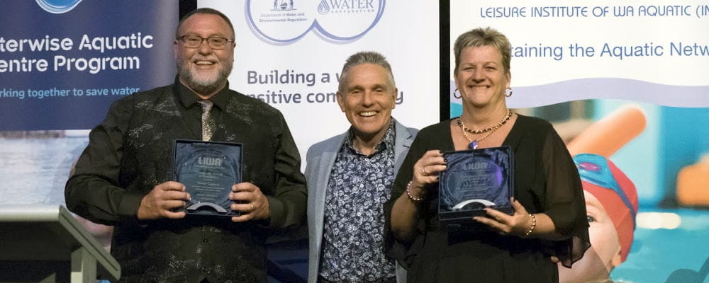 Trevor and Adele Caporn receiving their awards with LIWA President Jeff Fondacaro