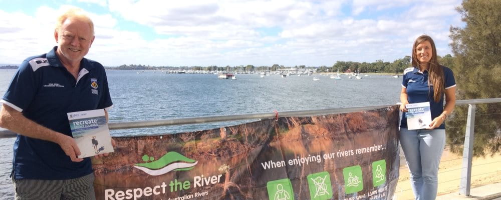 UWA Water Sports and Outdoor Program Manager Bob Herriman with program Coordinator Rita Pizzini with the Respect the River banner and the Swan River in the background