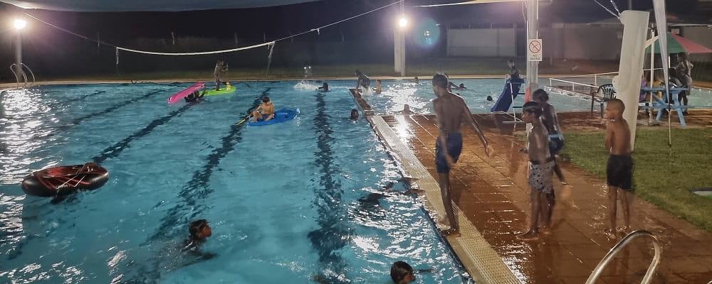 Warmun kids enjoying a night pool party