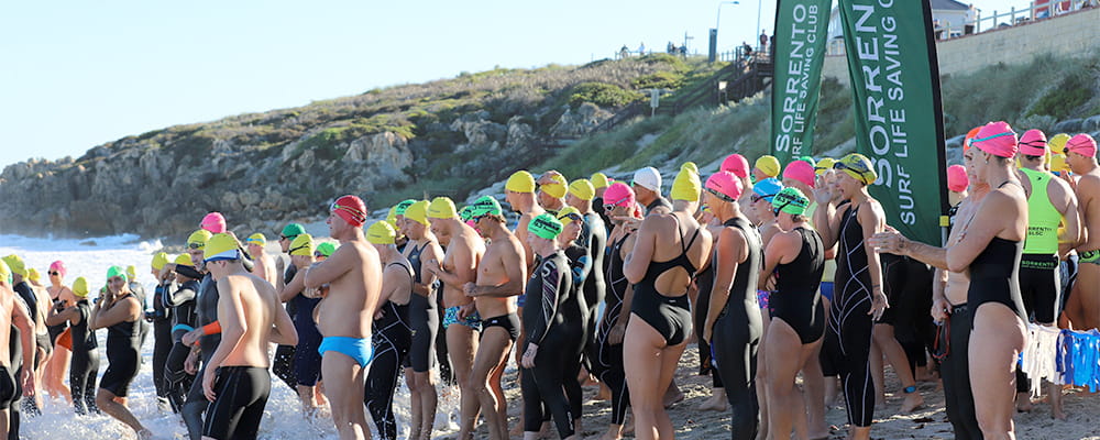 Hundreds of swimmers gathered on the beach at Watermans Bay