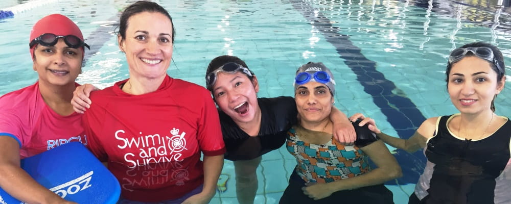 multicultural women with their instructor in the pool at Cannington