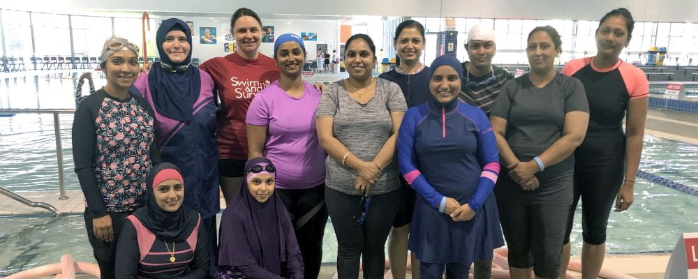Multicultural women with their instructor by the pool at Cannington Leisureplex