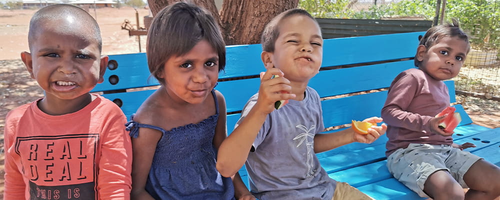 Aboriginal children enjoying fresh fruit