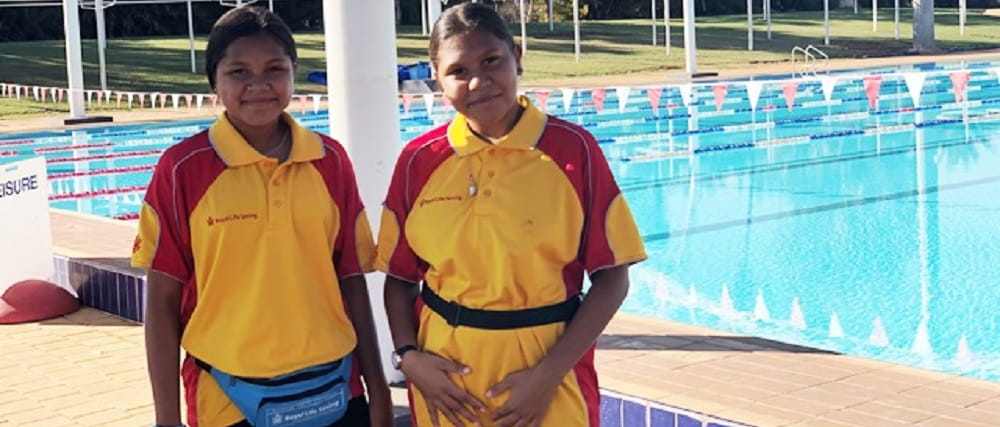 two Aboriginal girls training as pool lifeguards