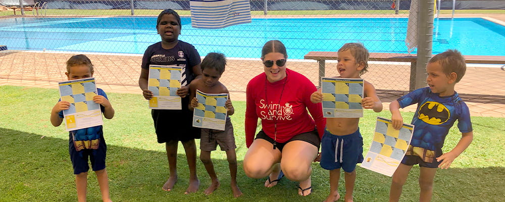 Swimming instructor Zoe Ross with children from Yakanarra Community School