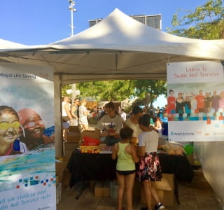 Volunteers and attendees at the Royal Life Saving stand during the Chung Wah Chinese New Year Festival in Northbridge