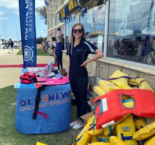 Royal Life Saving WA's Katie Cowcher at the Hillary's Yacht Club Open Day exchanging old lifejckets for new ones!
