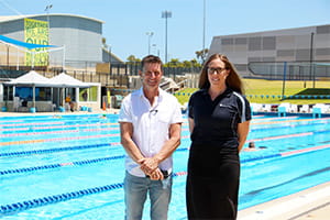 Phil Prosser with Royal Life Saving WA's Lauren Nimmo by the pool at HBF Stadium
