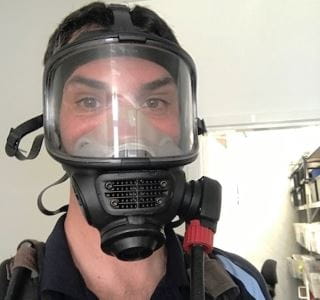 A Royal Life Saving staff member wearing an SCBA mask
