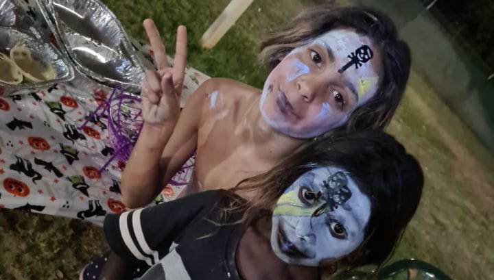 Two Aboriginal children with Halloween facepaint