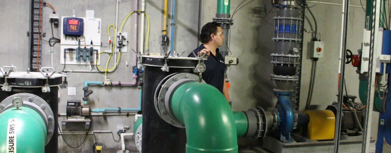 pool operator working in plant room