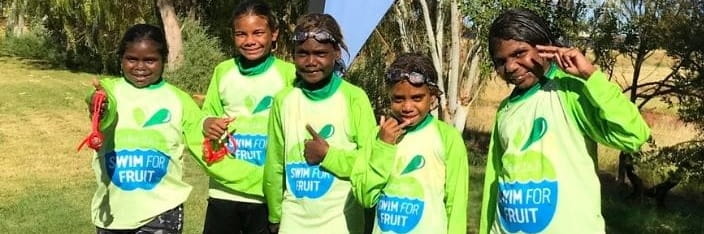 group of Aboriginal kids wearing Swim for Fruit rashies