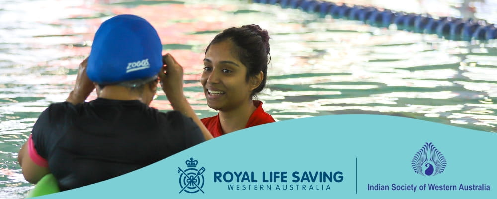 Indian woman attending a swimming lesson with female instructor